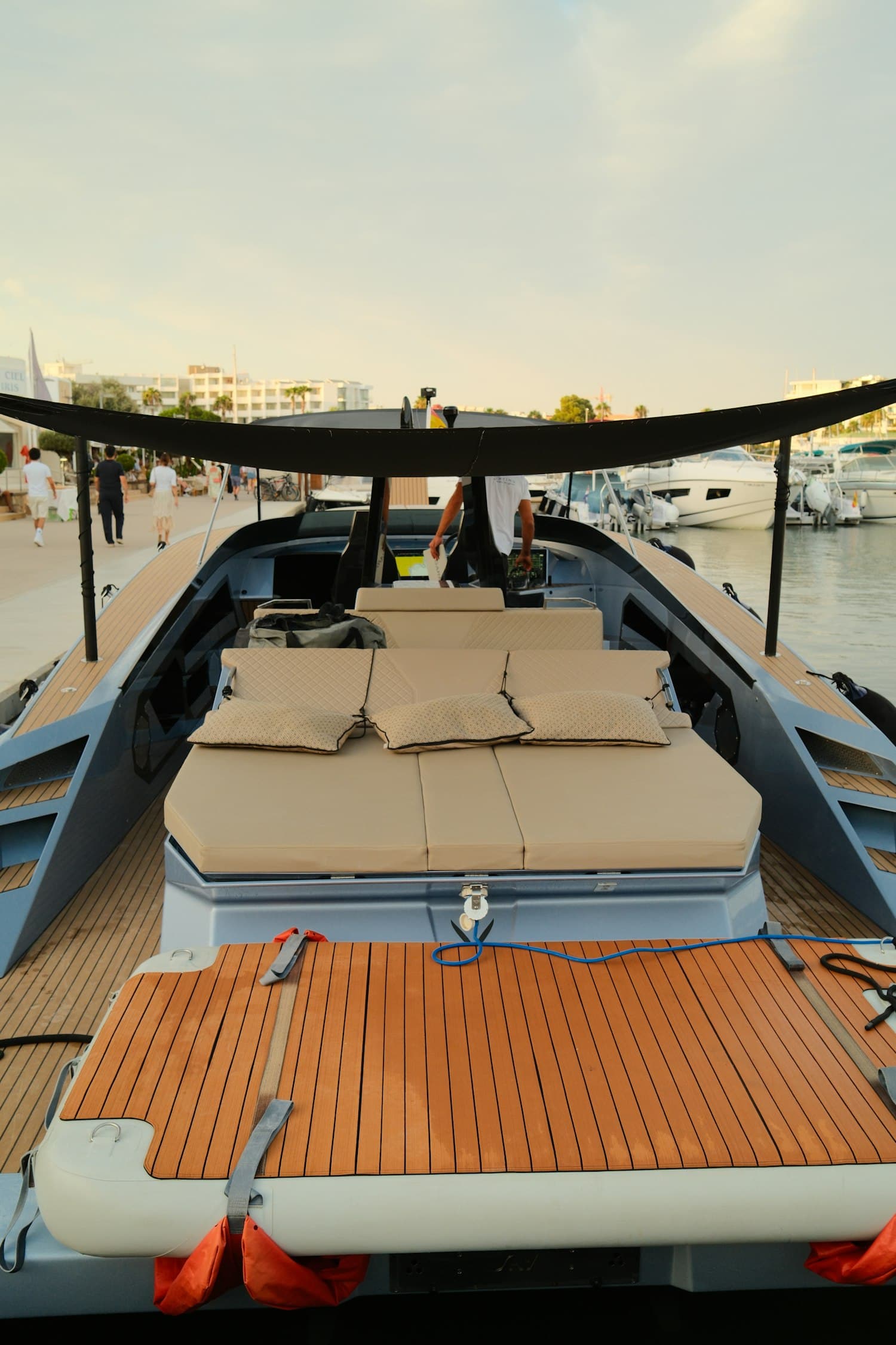 Teak deck with cushioned seating aboard a yacht