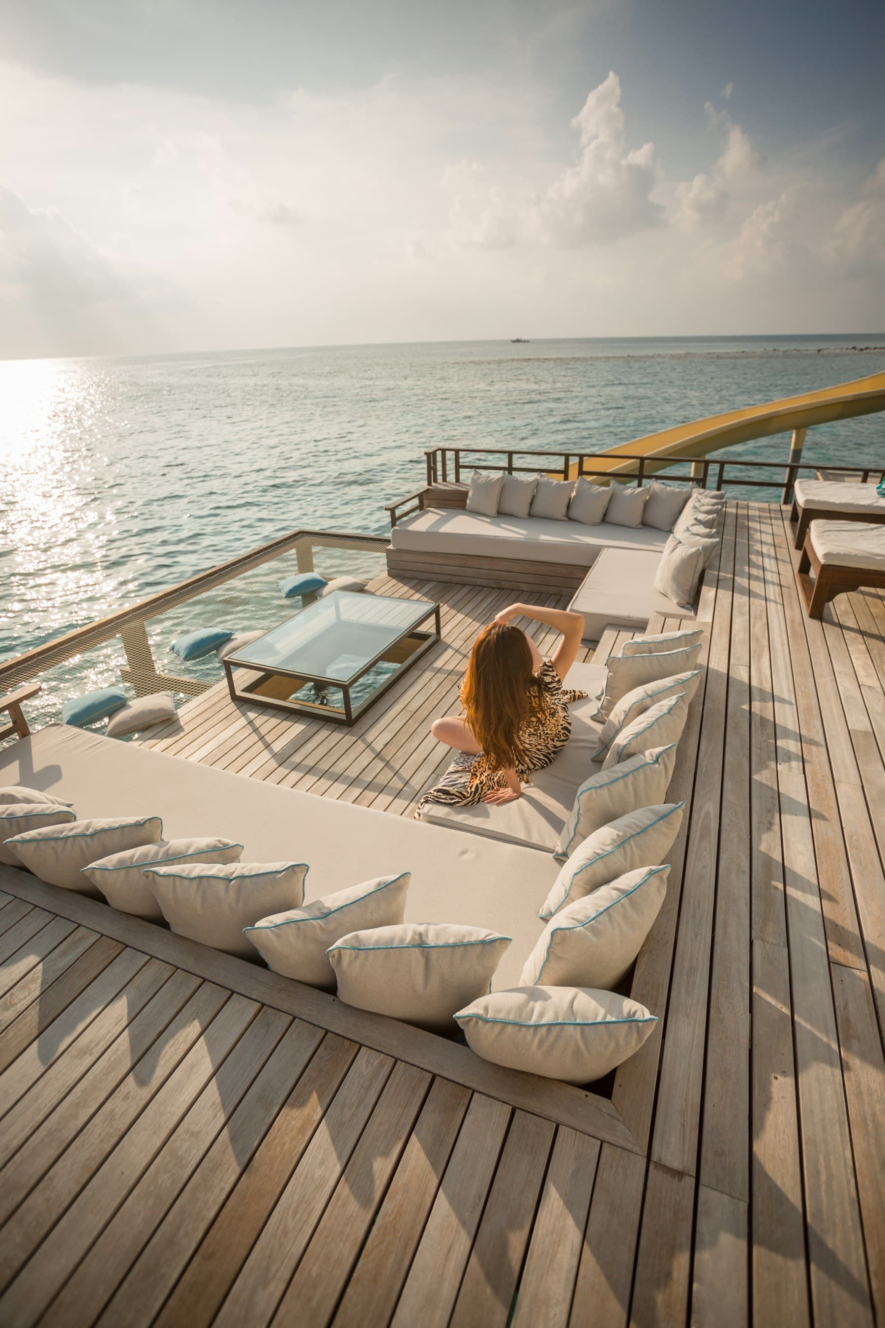 Sun deck of a superyacht with loungers overlooking the sea